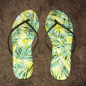 Never been worn tropical patterned flip flops!